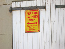 Ferrari Parking Sign.  Photo copyright Cold Spring Press.  All rights reserved.