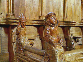 Carved wooden figures on Choir Stalls at Eglise des Augustins.  Photo courtesy of Jacques Mossot.