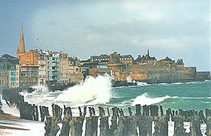 Waves crashing at St Malo.  Photo source unknown.